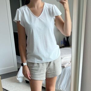White v-neck top with short flutter sleeves